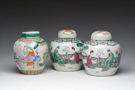 Three Chinese famille rose jars and covers with an