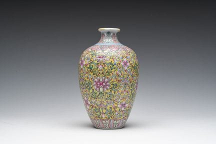 A Chinese yellow-ground famille rose vase with flo