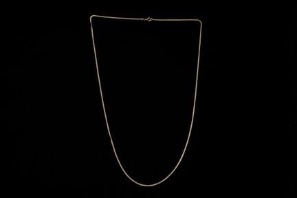 Collier en or jaune 18 carats, XXe siècle.


Poids