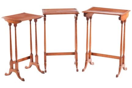 A nest of three bird's-eye maple tables, 19th cent