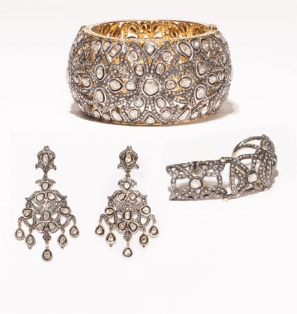 Conjunto de joyería en oro amarillo de 14k y plata