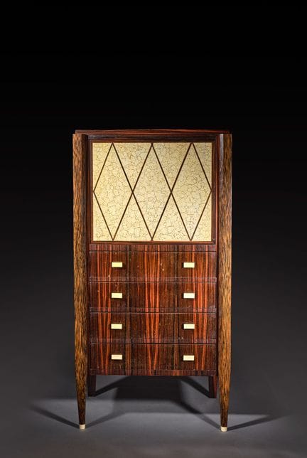 MODERN DESIGN
A drop-top secretary desk in palm ve