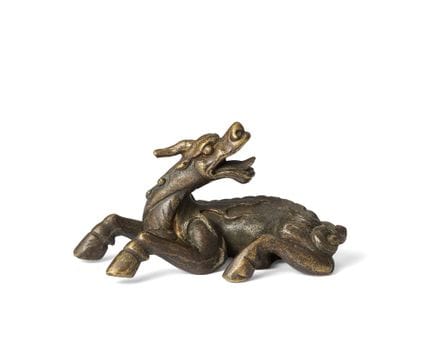 Un poids à rouleau chinois en bronze représentant 