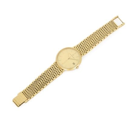 Carl Bucherer. An 18ct gold quartz calendar bracel