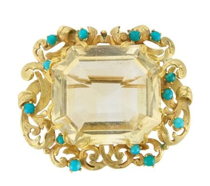 Une broche en citrine et turquoise, composée d'une
