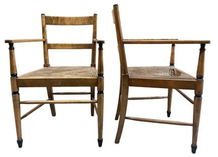A pair of large armchairs with openwork backs feat