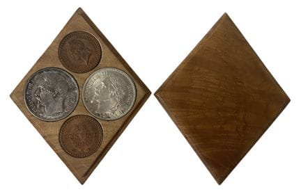 A small, diamond-shaped box made of boxwood contai