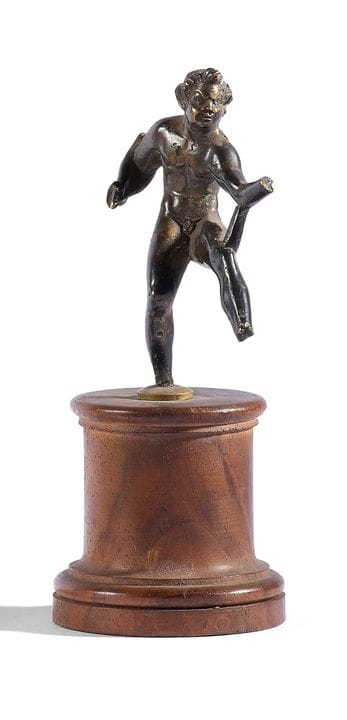 Bronze statuette depicting a satyr with a dark pat