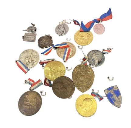 In a display case, a set of white or gold-colored 