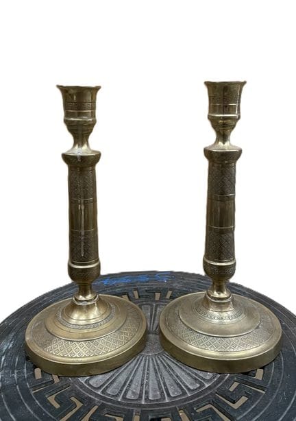 Two brass candlesticks with a checkered pattern. R
