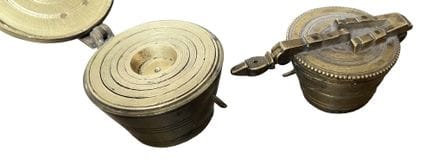 Two stacks of Nuremberg weights known as "brass cu