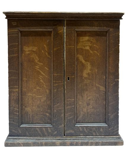 Molded oak display cabinet. It opens with two door