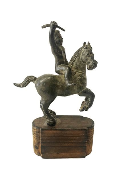 Patinated bronze statuette depicting a horseman ho