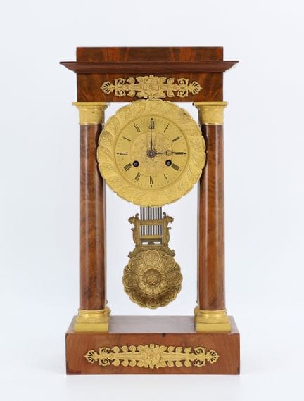 Mahogany and mahogany-veneered portico clock with 