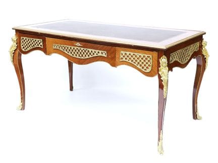 A rectangular, flat-sided desk made of veneered wo
