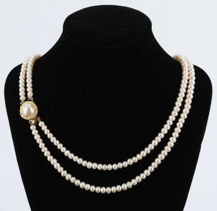 Double-strand pearl necklace with a gold-plated si