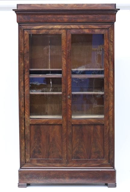 Mahogany and mahogany-veneered bookcase with two g