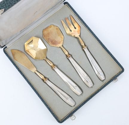 Art Deco-style dessert set with silver-plated hand