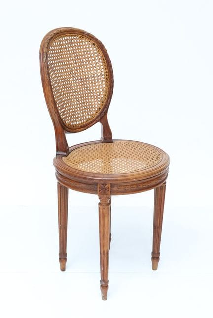 Small chair with a medallion-shaped back made of m