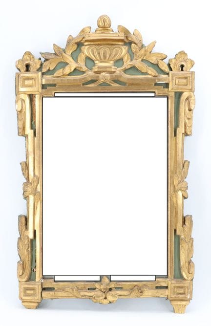 Molded, carved, and gilded wooden mirror with a gr