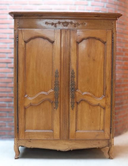 Natural wood cabinet, molded and carved, with doub