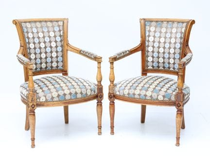 Pair of natural wood armchairs, molded and carved,