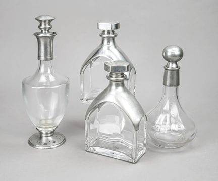 Quatre carafes ornées de montures en étain, France