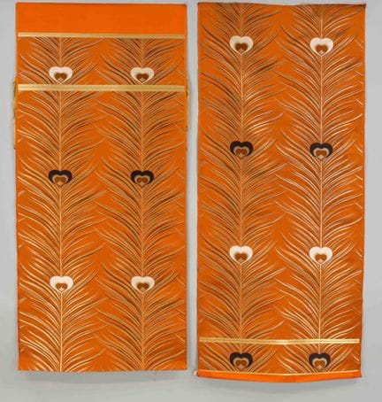 A few lengths of silk fabric with a peacock feathe