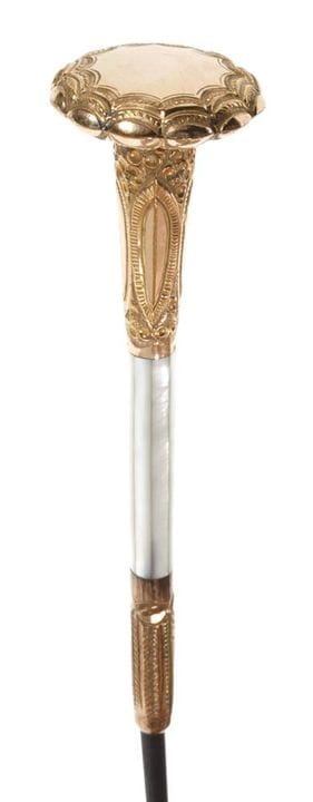Dandy Stick
circa 1920, slender knob in gilded bra