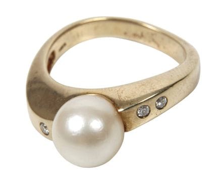 Anillo de mujer con perla y diamantes
de época mod