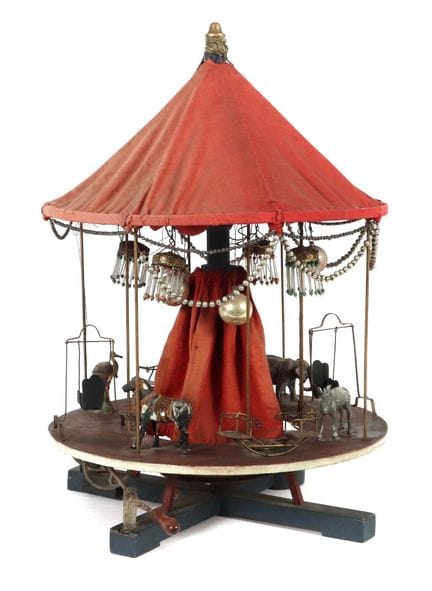 Carrousel de fabrication artisanale datant des ann