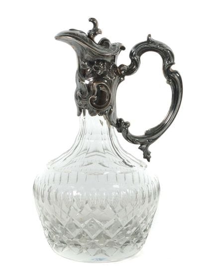 Carafe, circa 1900. Colorless, faceted glass. Moun
