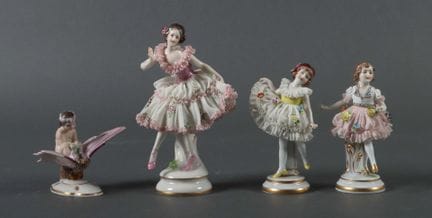 Four figures, including: Aelteste Volkstedter Porc