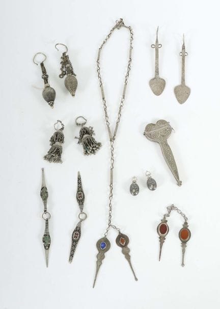 Assortment of Turkmen jewelry and a pair of scisso