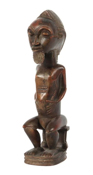 Figurine Blolo Bian assise, originaire de la tribu