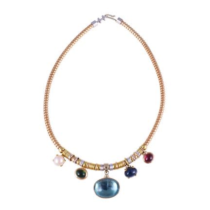 * COLLIER  « tubogas », en or jaune et blanc 18 ca