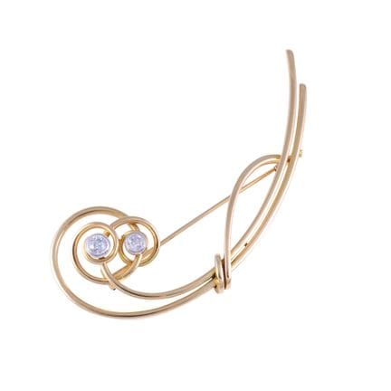 BROCHE en or jaune et blanc 18 carats, en forme de