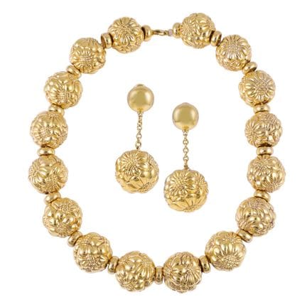 PARURE en or jaune 18 carats, composée d'un collie