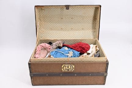 Fashion doll travel trunk with a domed lid, contai