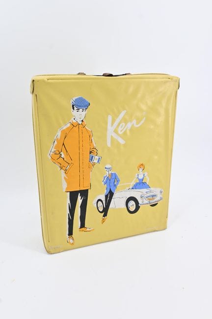 Padded suitcase containing: 
- Ken doll 
- wardrob