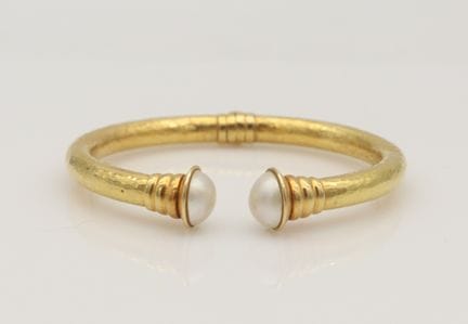 An 18K Gold and Cultured Pearl Hammered Open Bangl