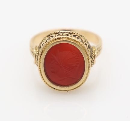 A gold carnelian intaglio signet ring. Stamped A.5