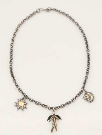 Zolotas silver and gold necklace with a radiant su