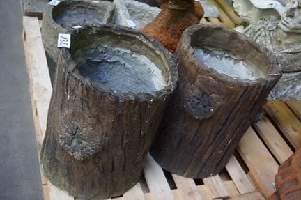 2 large concrete flower pots—shaped like tree stum
