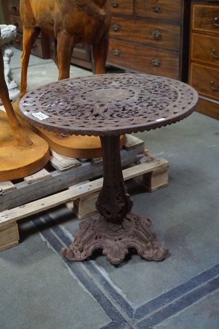 Round cast-iron patio table—on a central leg—diame