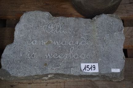 Blue stone sculpture—featuring a quote by the Dutc