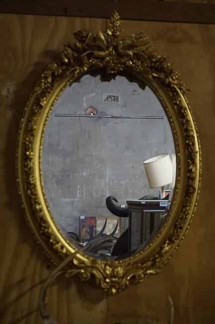 Beautiful oval gilded mirror—decorated with lovebi