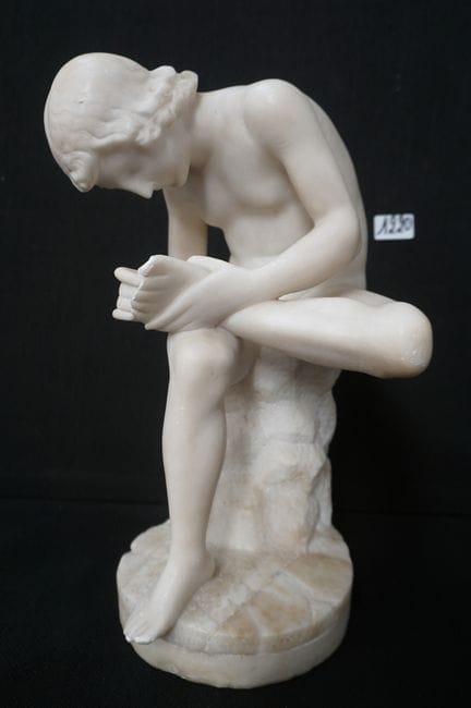 19th-century alabaster sculpture—“Spinario”—with a