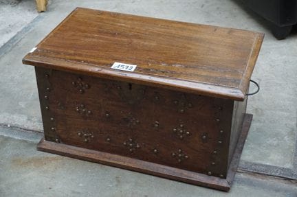 Colonial-style trunk—decorated with brass hardware