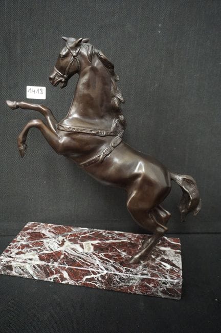 bronze sculpture on a marble pedestal - "rearing h